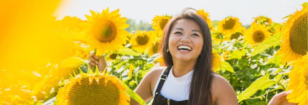 Girl enjoying an organic farm and sunshine