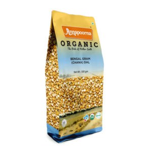 Annapoorna Organic Bengal Gram (Chana) Dal packaging, predominantly yellow with a clear window displaying the lentils. The package indicates it as a 500 grams organic product with the tagline 'The Pride of Mother Earth' and various certification logos.