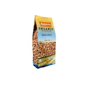 Packaged product of Annapoorna brand's Organic Brown Chana (brown chickpeas), with a clear window showing the chickpeas inside, suggesting an organic and natural quality of the product.